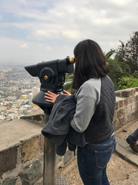 Viewing the city through a telescope in Santiago, Chile