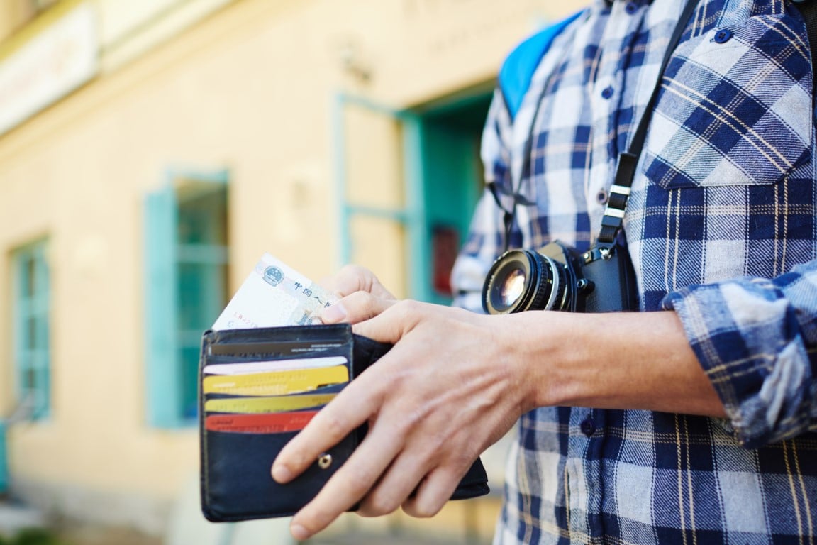 Foreign currency exchange traveler with money