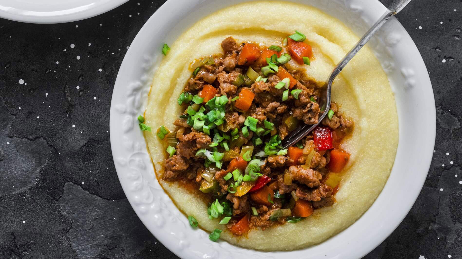 Polenta with pork sausage tomato sauce stew 