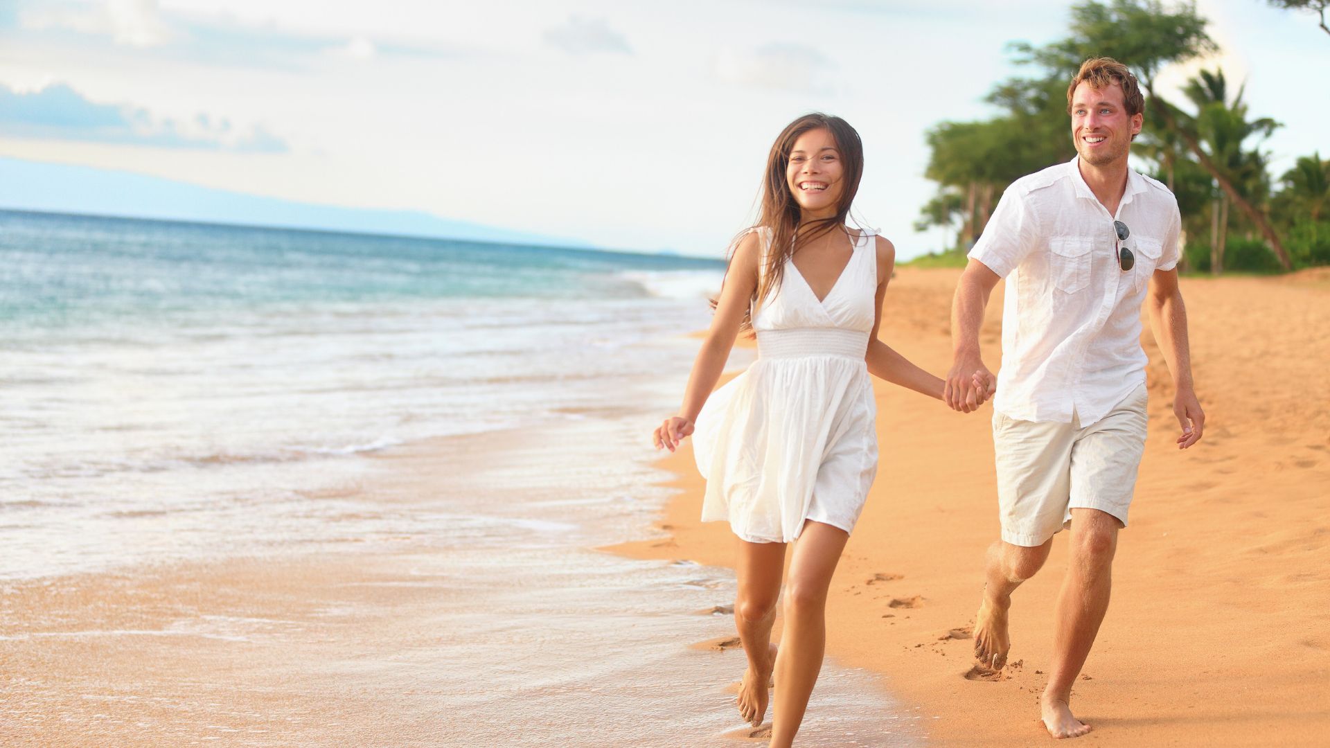 Couple running on the beach